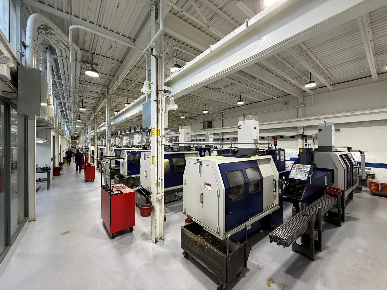 Gates Albert production floor — rows of Davenport multi-spindle machines in operation